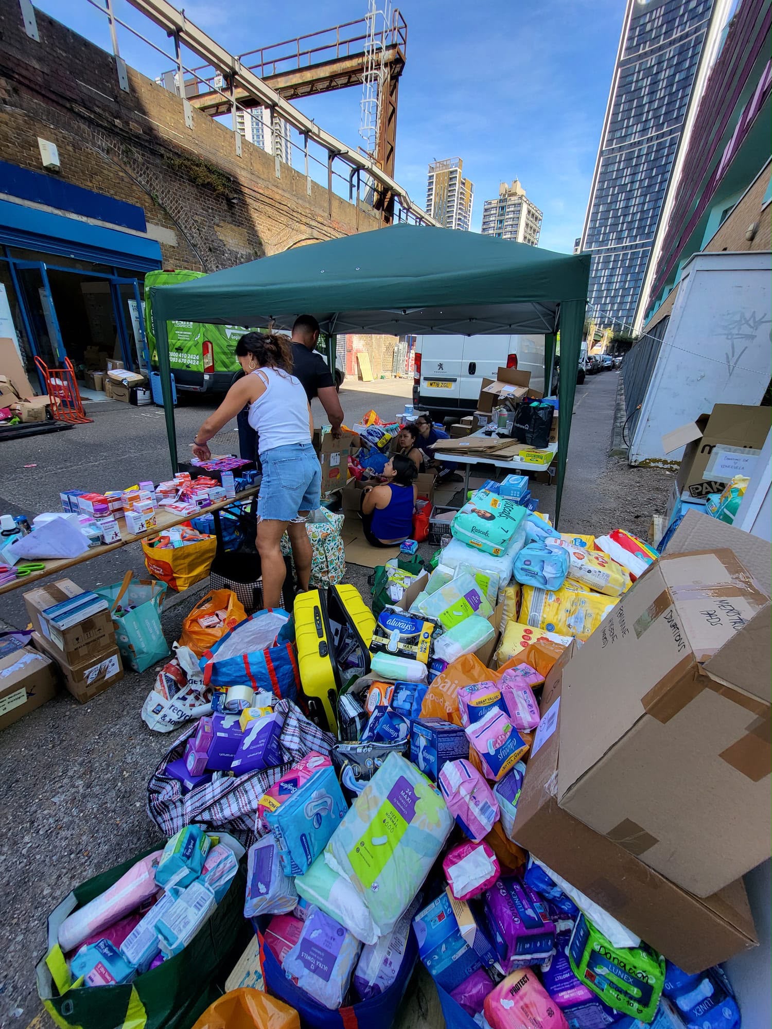 Donated goods being carefully packed.
