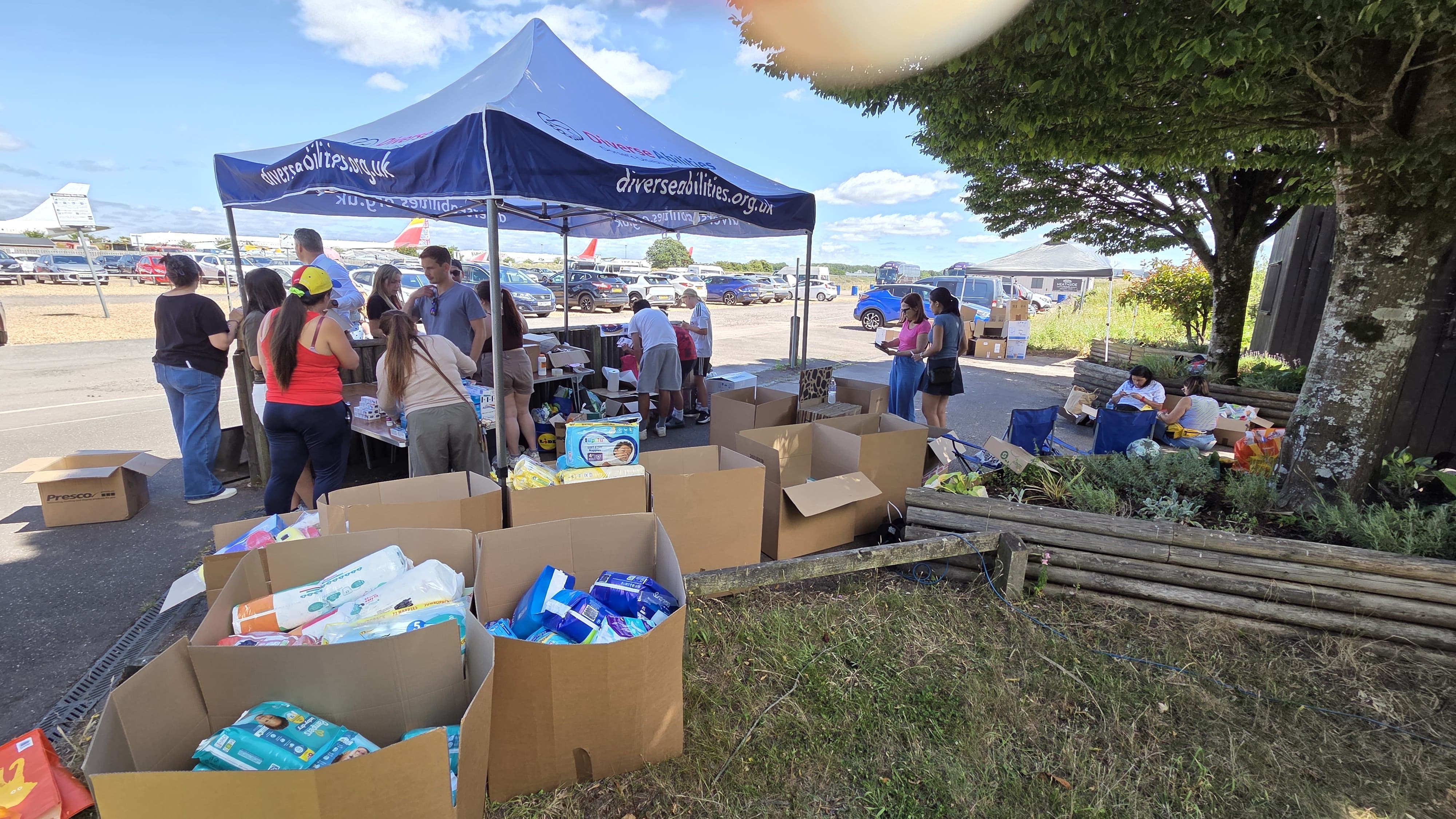 A collection point busy with donations coming in.