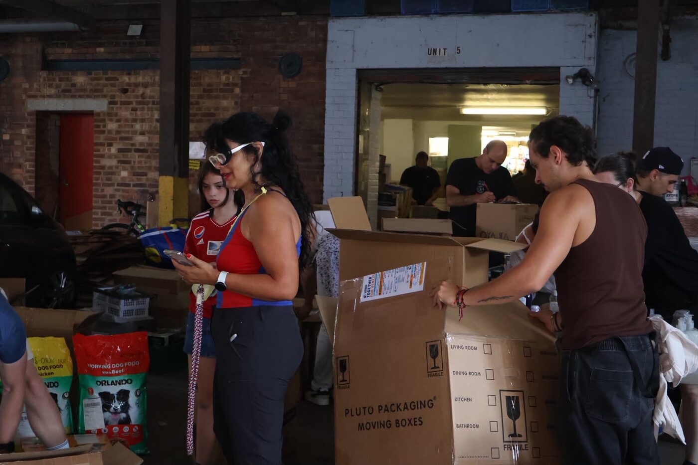 Volunteers preparing donated aid, London, August 2026